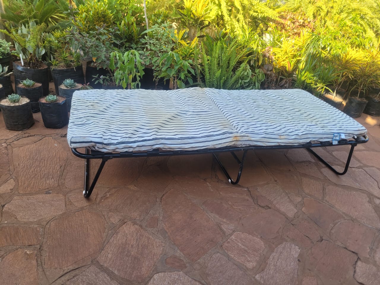 Folding bed complete with mattress